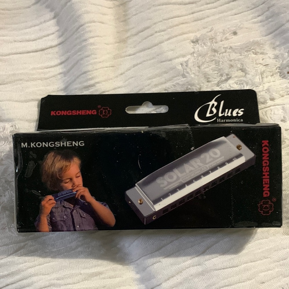 Brand new in the box solar, 20 harmonica